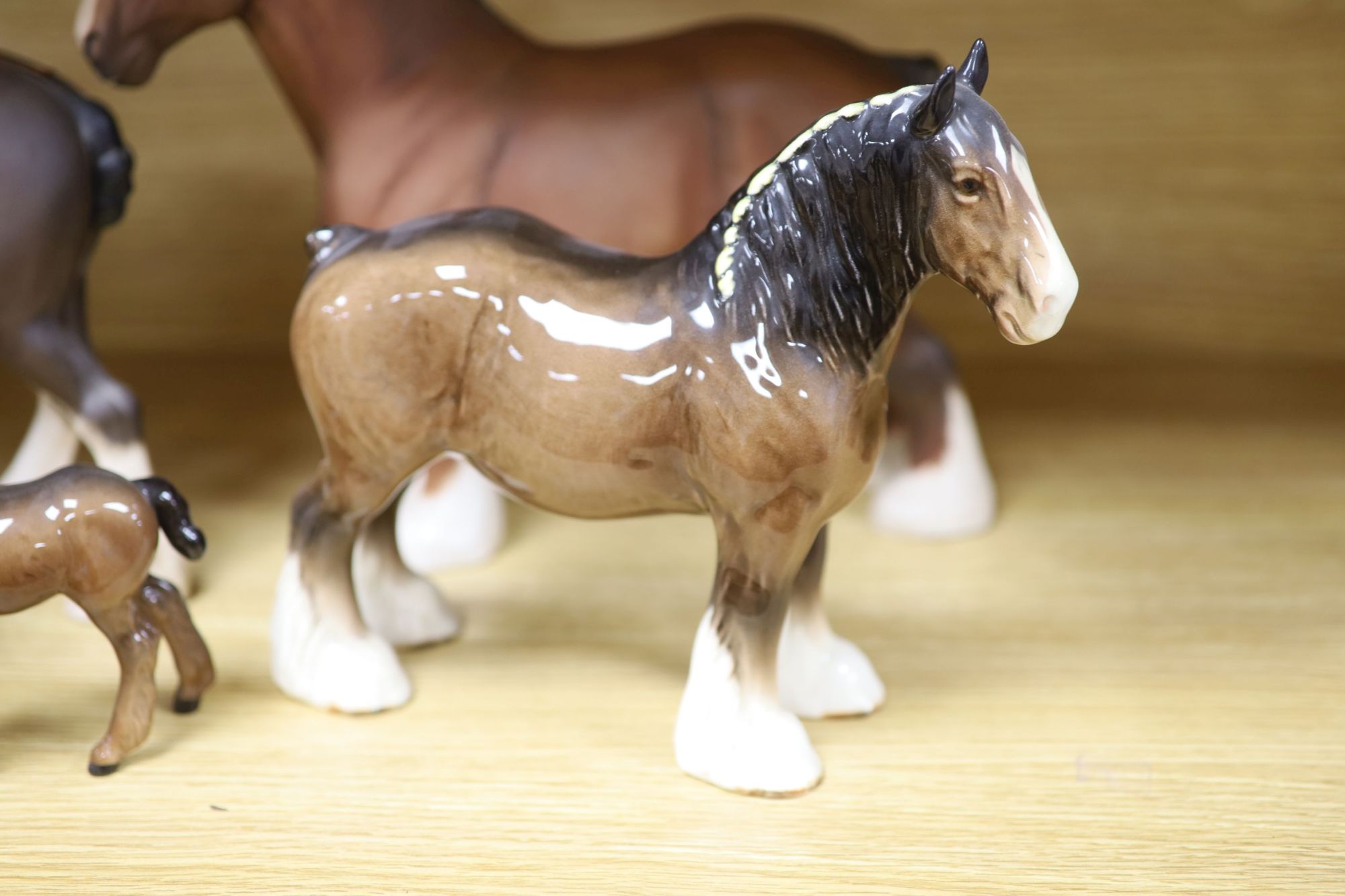 Five Beswick shire horses and a foal